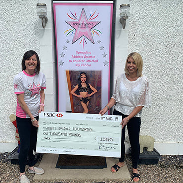 Abbie's Sparkle Foundation receiving cheque