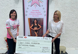 Abbie's Sparkle Foundation receiving cheque