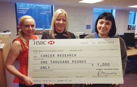 AYMES donates £1000 to Cancer Research UK