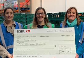 AYMES partnership manager handing over cheque