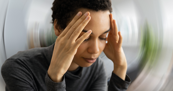 Lady holding her head