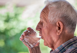 Elderly gentleman drinking water