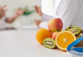 picture of fruit with dietitian in the background
