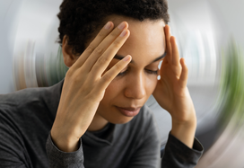 Lady holding her head