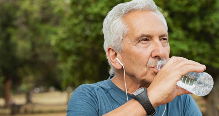 Older man drinking water
