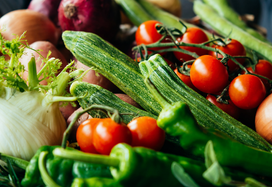 lady holding basket of fresh vegetables
