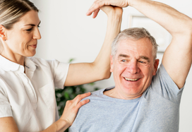 Healthcare professional doing excercises with man