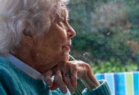 malnourished lady sitting at window
