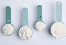 measurement cups with powdered ONS in them