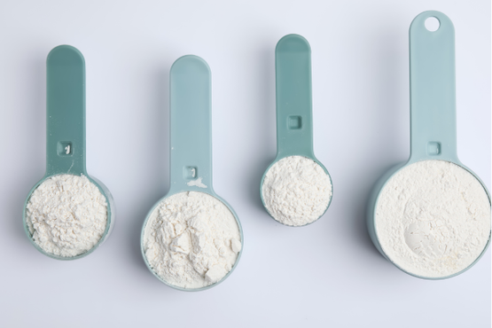 measurement cups with powdered ONS in them