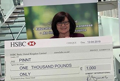 Lady from PINNT receiving cheque from AYMES