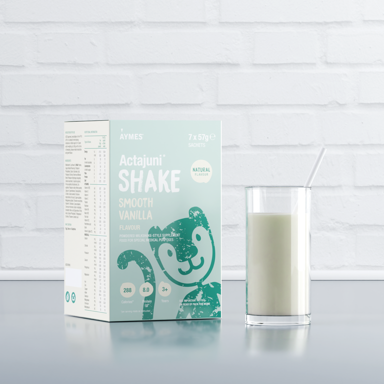 Glass of Actajuni Shake with carton